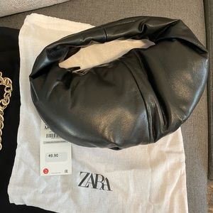 Black faux leather shoulder purse.